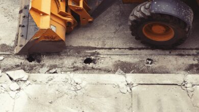 Heavy machinery repairing a road